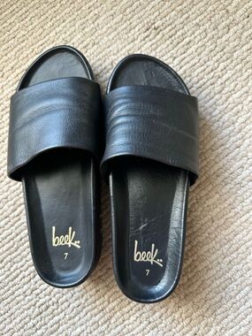 beek Black Leather Slide Sandals with Gold Logo